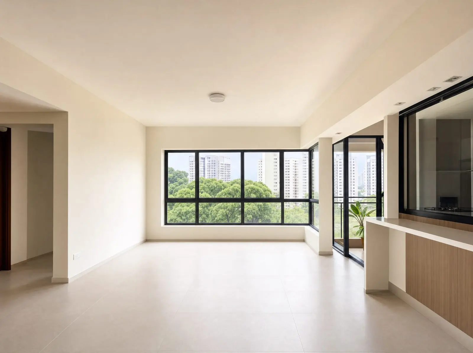 An empty, newly renovated apartment with large windows